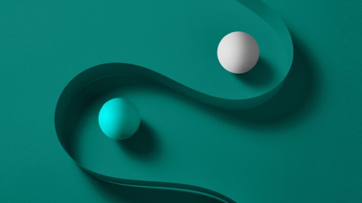 abstract of two balls with a ribbon