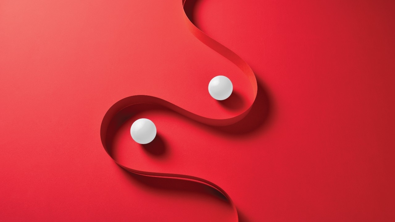 Abstract of balls within red ribbon