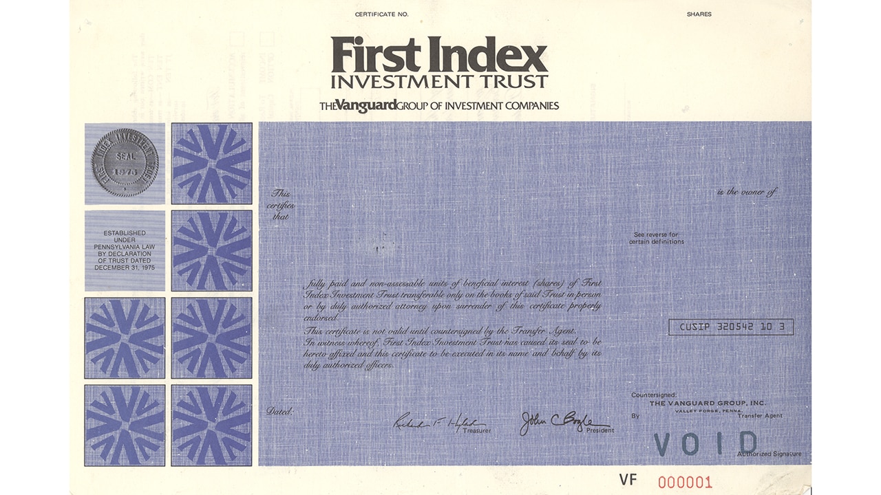 An image shows a physical share certificate for First Index Investment Trust, a member of The Vanguard Group of Investment Companies. 