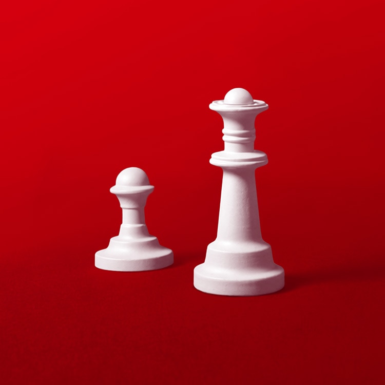 White chess queen and pawn standing side by side on a red background.