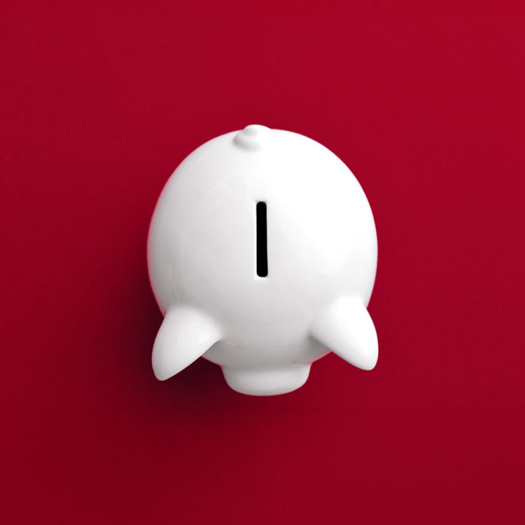 Piggy bank on red background