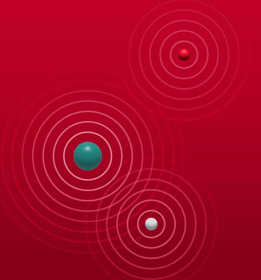 Abstract illustration of three spherical objects on a red background, each surrounded by concentric circular wave patterns. One large teal sphere appears on the left side, a smaller red sphere is positioned in the upper right, and a small white sphere is located toward the lower right. The circular rings around each sphere overlap slightly, suggesting signals, ripples, or radiation emitting outward in all directions. The background is a uniform gradient of red, and no text is present.
