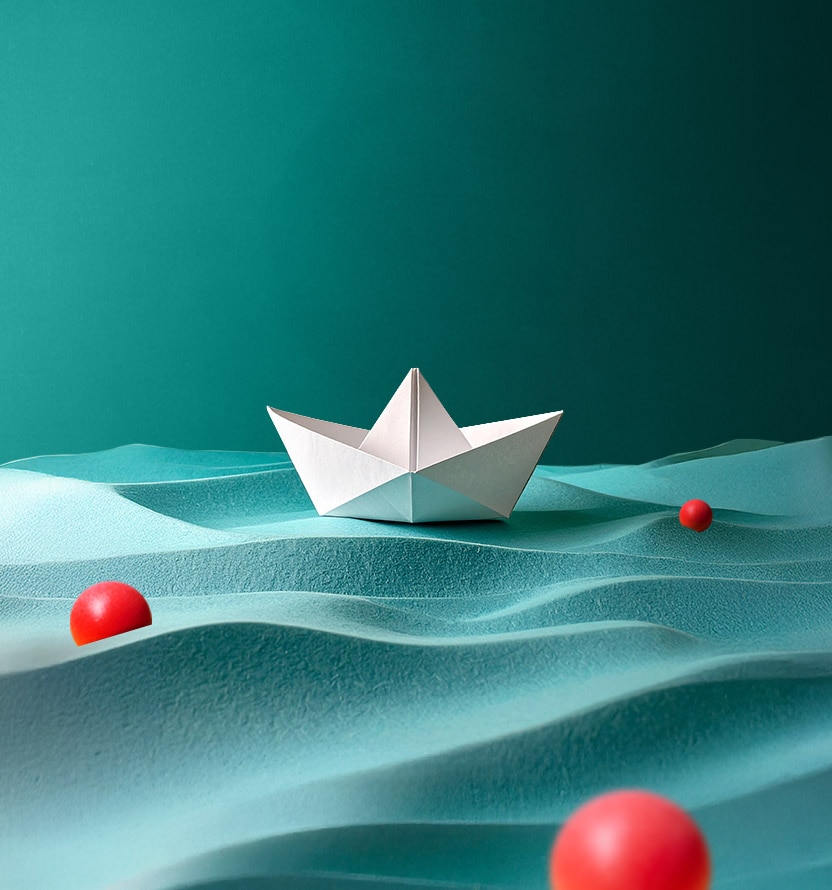 Abstract image of a paper boat on a blue sea