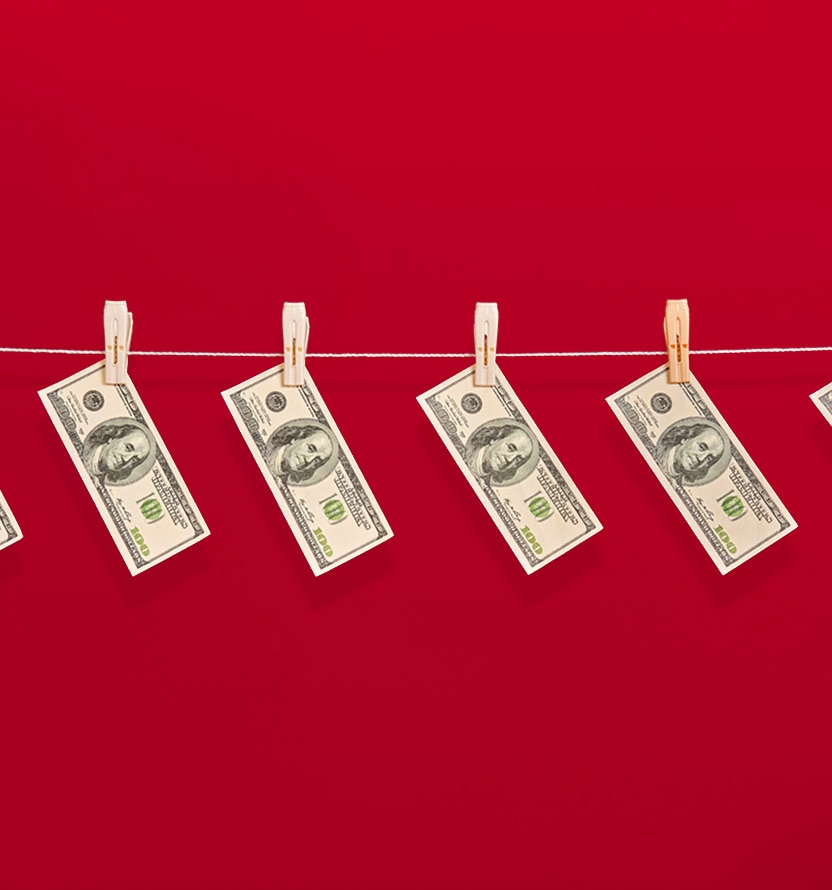dollar bills hanging on a line