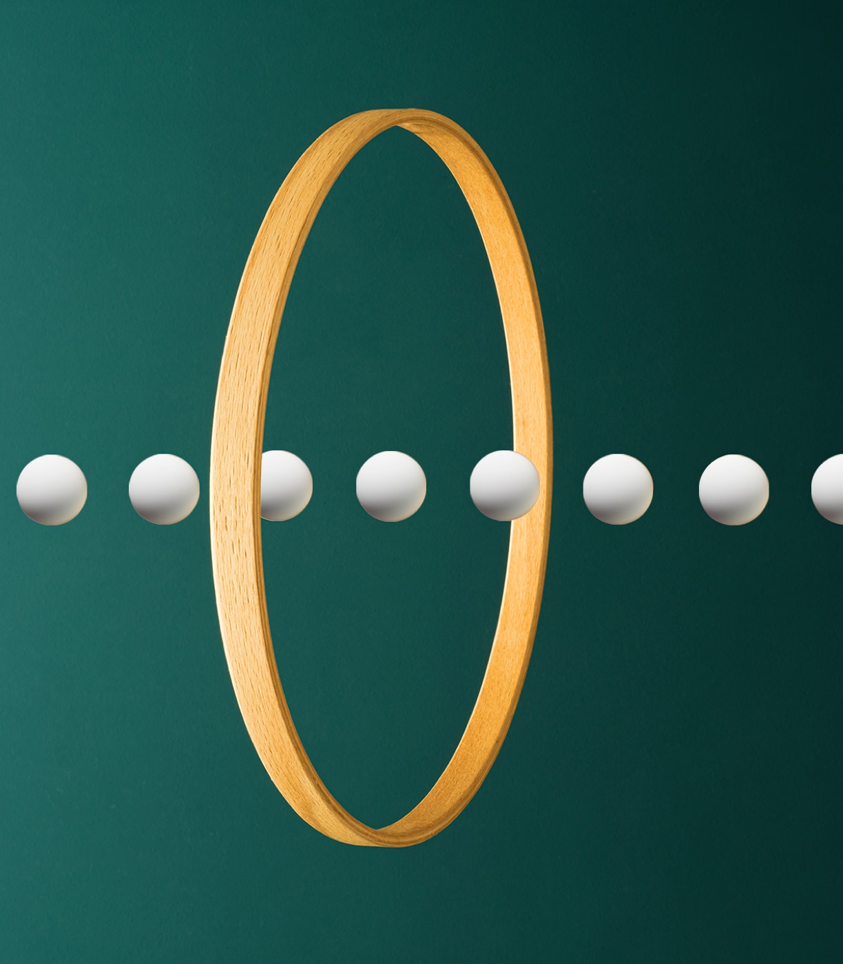 Illustration showing several balls in a straight line passing through a ring. 