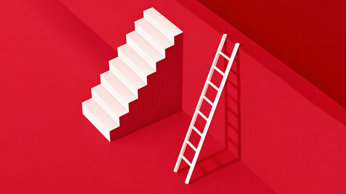 White staircase and white ladder standing side by side against a red geometric background, illustrating two paths upward.